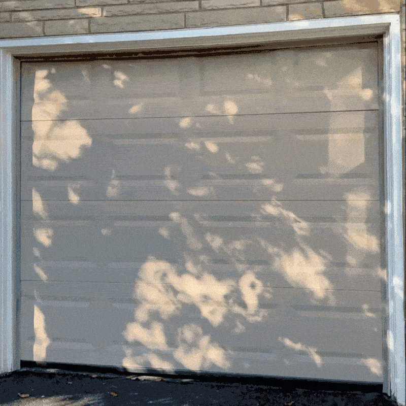 GIF of a garage door opening and closing to reveal an Ohio small business workshop.