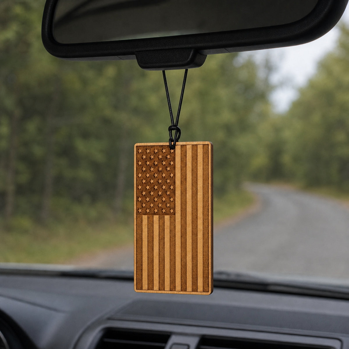 USA Flag wooden car air freshener hanging from a rearview mirror